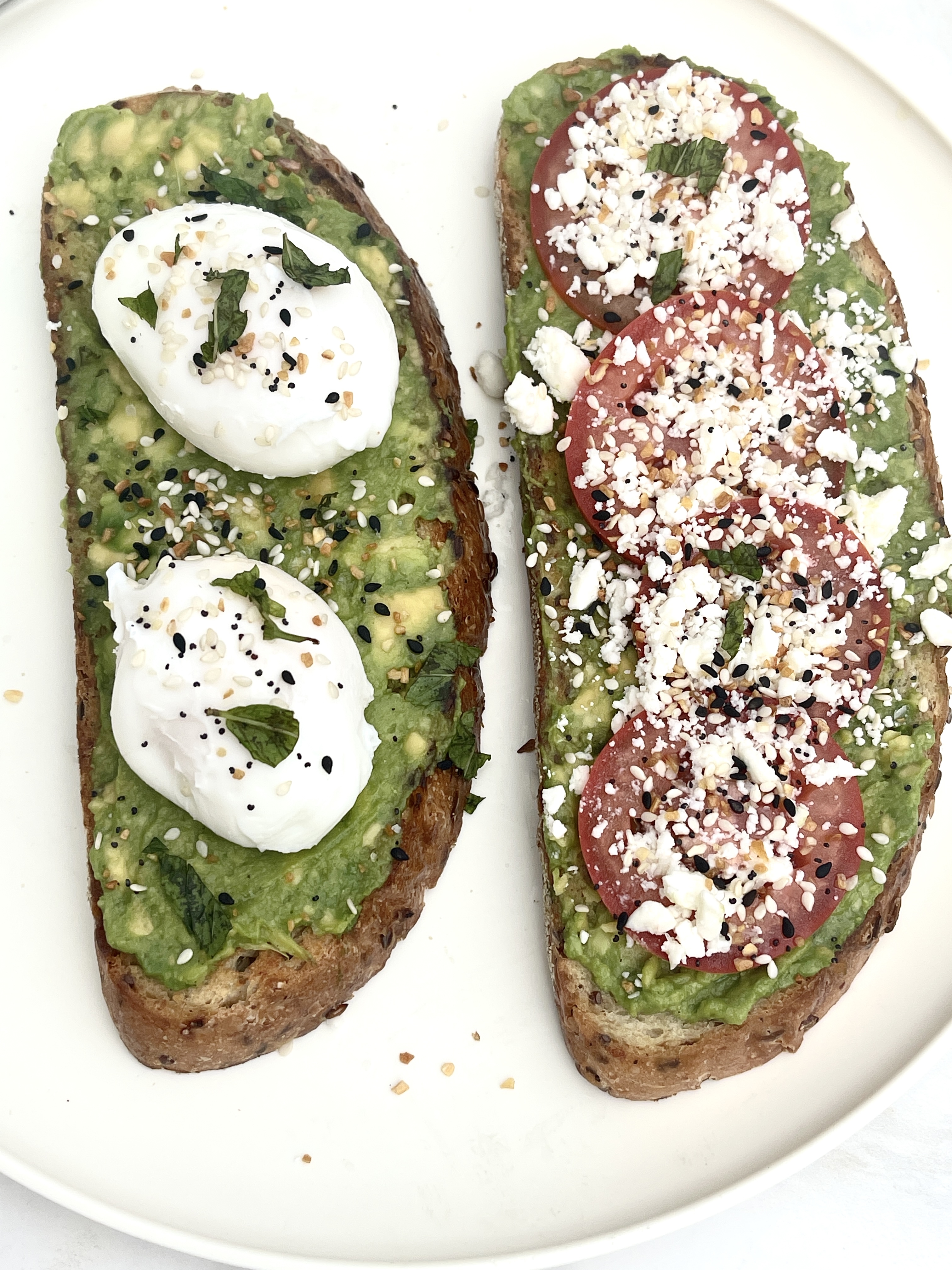 Avocado toast with tomatoes and feta cheese.