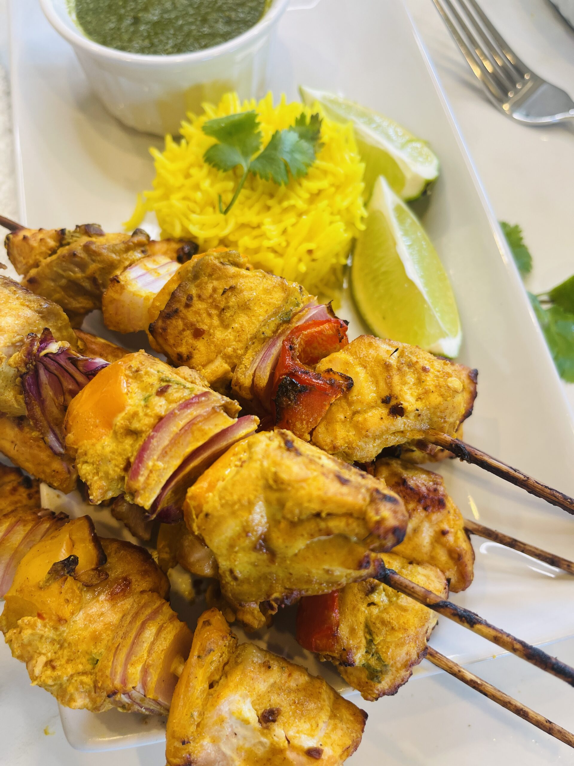 Salmon Tikka served with rice and green chutney