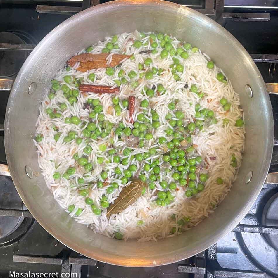 Adding rice in to the peas