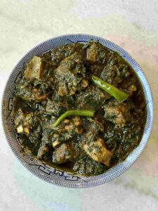 Palak Gosht serving in blue bowl