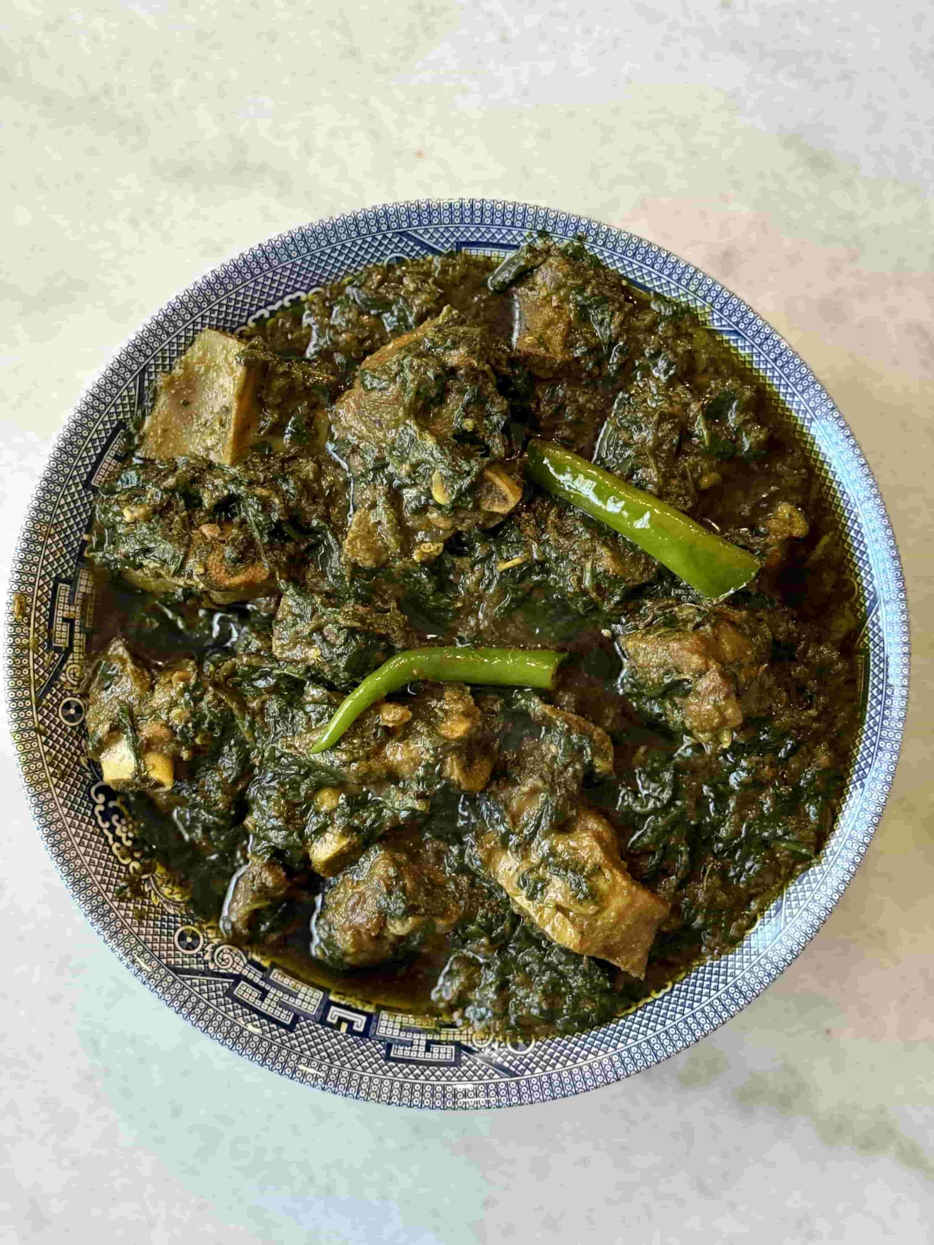 Palak Gosht serving in blue bowl